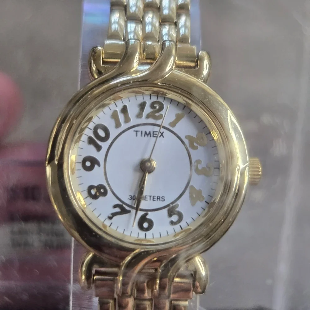 Vintage Timex Women's Gold tone Round Swirl Watch T119 White Dial 30M Old Stock